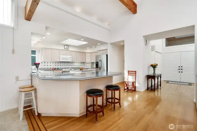 The spacious kitchen has easy access from both the garage and front door. Plenty of room for counter seating.