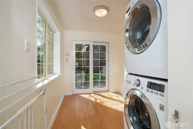 This are is large- current owner had laundry brought up from the basement which makes this home completely one level livable for now and the future.  Need another room for whatever your heart desires?  Move laundry back downstairs and you have an office or hobby room or great room area off of kitchen.  Sliding French doors lead to the back deck and yard- again, super easy entertaining, dining al fresca, or cleaning off in mudroom after playing outside.