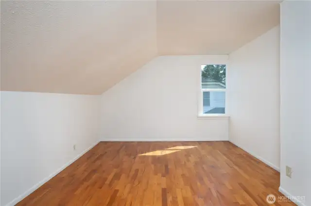 Upstairs, the bedrooms are huge and here we get to see the gleaming hardwoods.