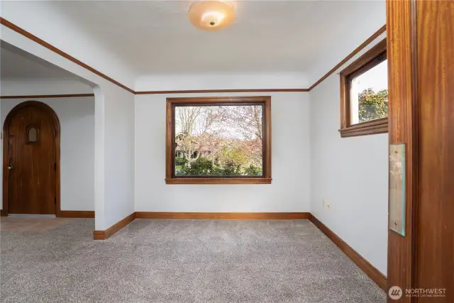 The dining room is adjacent to the living room.  It is substantially sized- full sized dining tables, a side board and hutch, and lots of guests have no problem all fitting in here and the generous picture window floods the area with natural light.