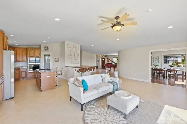 Great room leads to formal dining/flex room