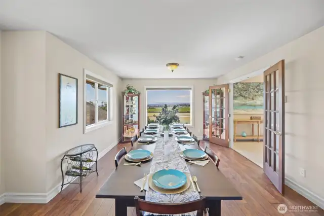 Formal dining room with French doors and view - room to host large dinner parties