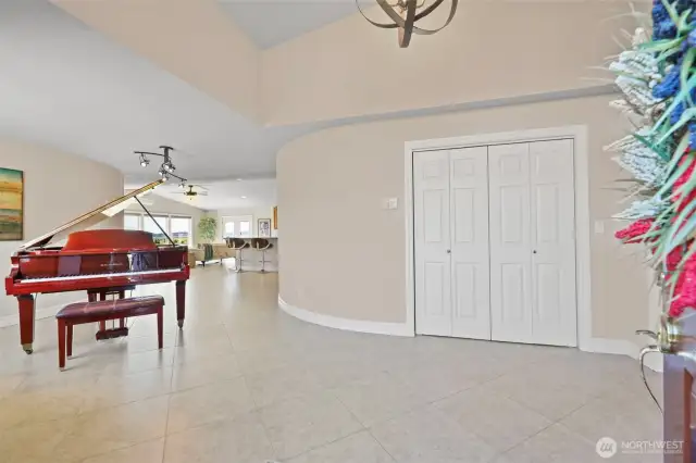 Custom curved walls greet you in the entry