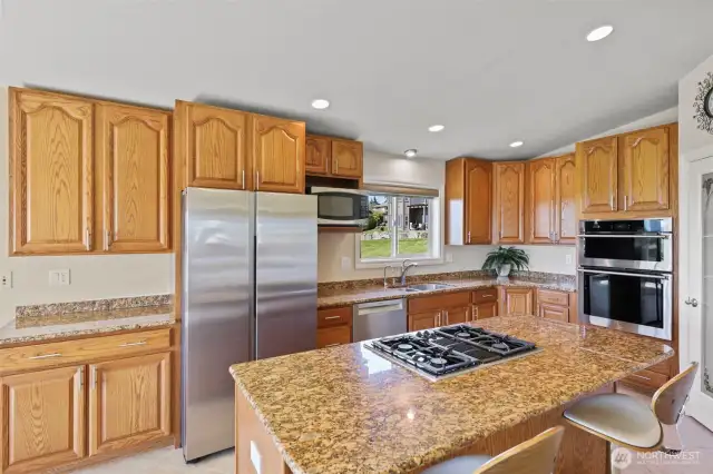 Gourmet kitchen w/ center island, gas stove top, SS appliances. dbl convection oven