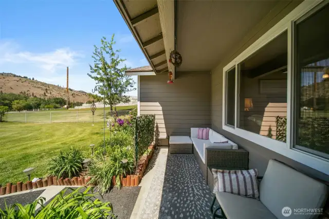 Front covered patio, looking out onto the front yard.