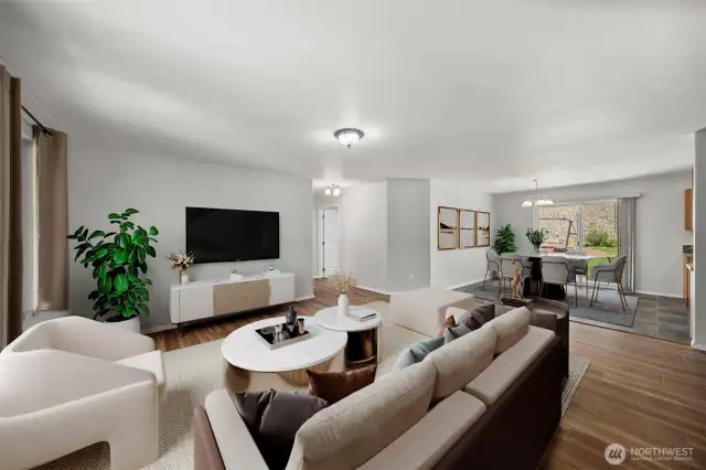 Virtually-staged living room and dining room (currently empty).