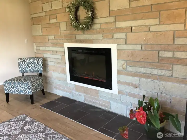 This fireplace feature is brand new in late October.  It is remote controlled, has different visual flame features & a built in 1,500 watt electric heater.