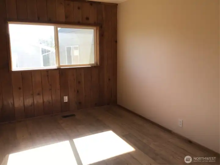 The first bedroom once entering the hallway on the left.  Brand new flooring and paint.