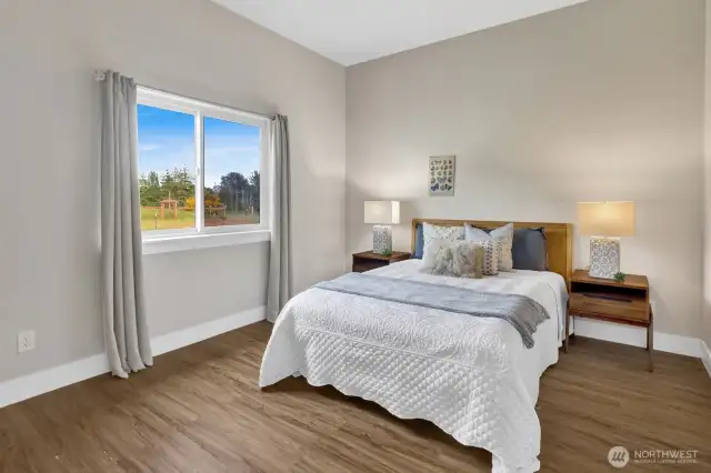 ADU bedroom with views of orchard and gardens.