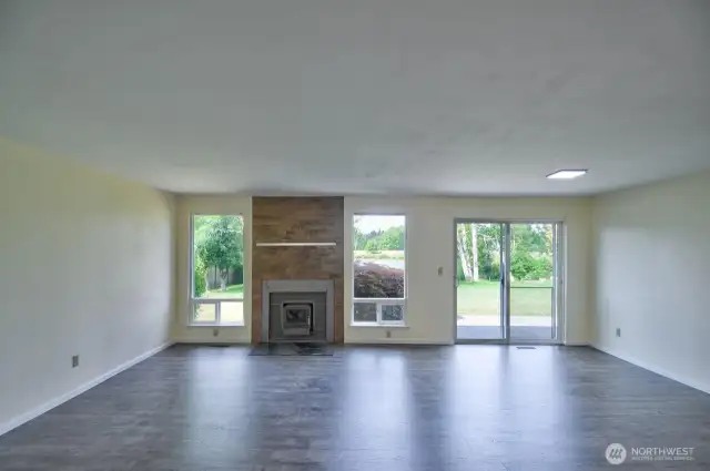 Great room style living/dining & kitchen with wood burning stove for winter evenings.