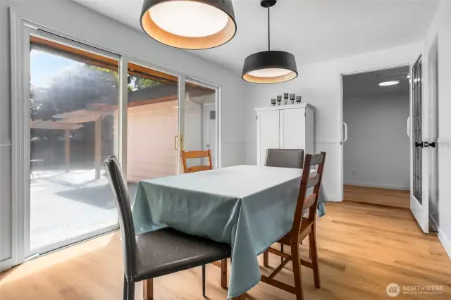 Main area dining room off kitchen, with wall of windows and slider access to patio