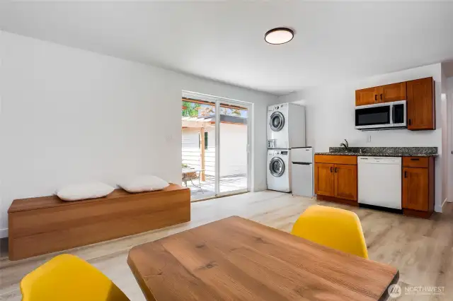 Virtually staged ADU living room with kitchenette and slider access to patio