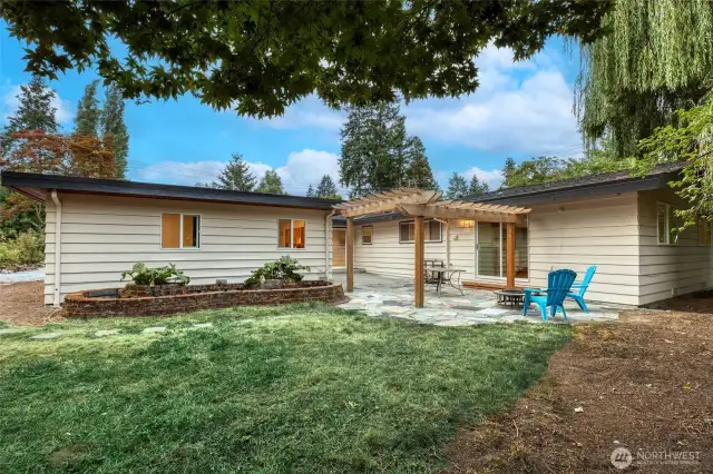 Back yard with patio accessible from main area dining room, ADU and west wing family room