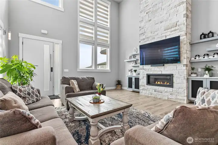Living room with storage shelves & cabinets.