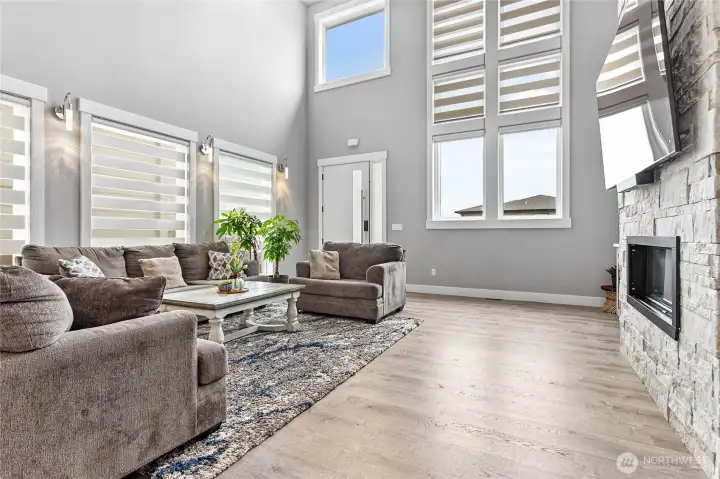 View of living room with, full of natural light with lots of windows.