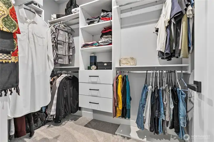 Primary bedroom walk in closet