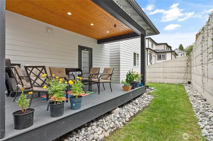 Covered back patio and backyard.