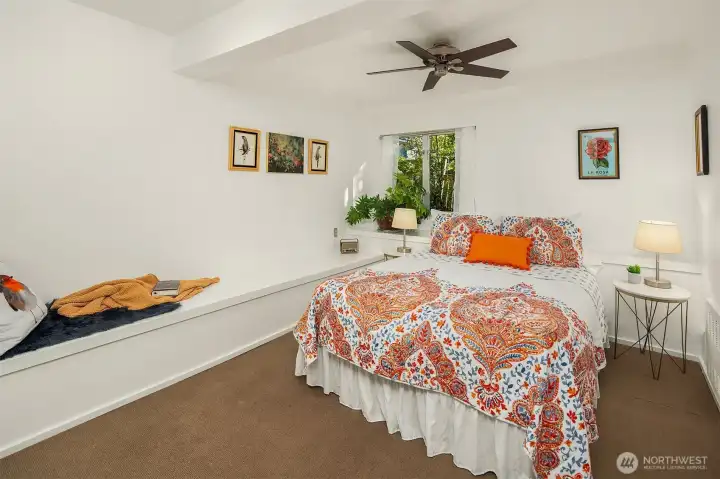 One of two lower level bedrooms. Spacious and bright and perfect for creating a space to read and enjoy the quiet.