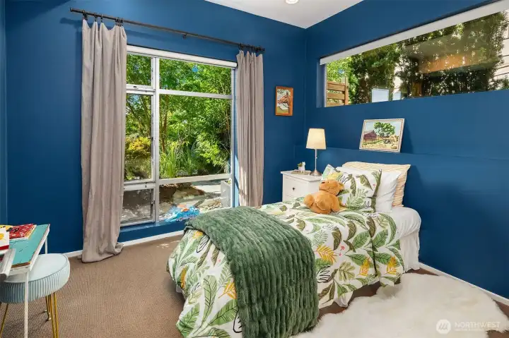 One of two lower level bedrooms. This could also be an amazing home office with views to the garden.