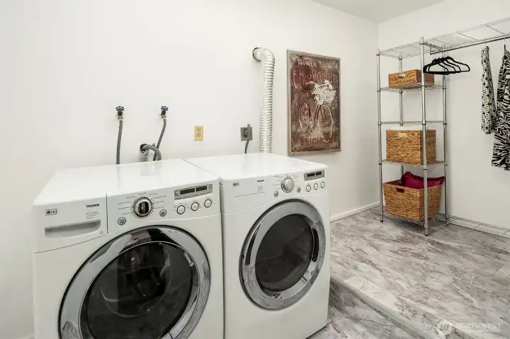 New flooring and paint in laundry room. Command central is ready for you to customize this space to your specifications.