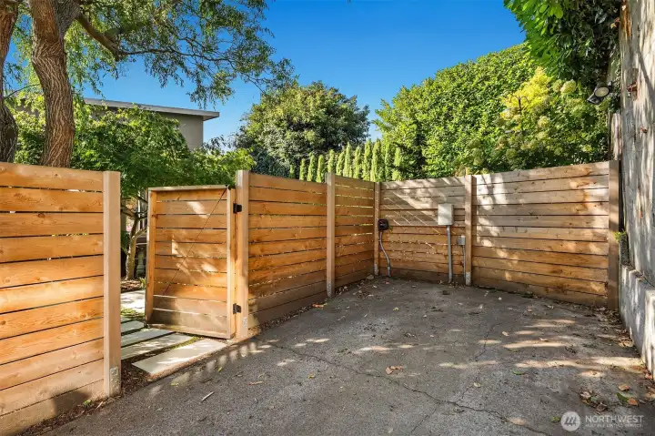 Dead-end decommissioned city alley is perfect for level entry to home and for EV charging.