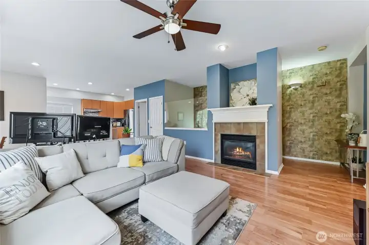 A cozy gas fireplace adds warmth and ambiance to the main living space, creating the perfect spot to unwind. LVP flooring extends throughout the living areas and bedrooms, offering both style and durability.