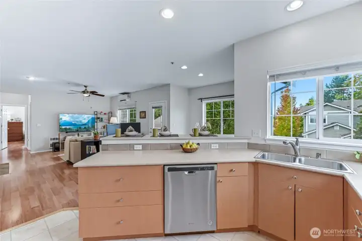 The wall of windows in this top-floor end unit brings in abundant natural light, creating a bright and welcoming atmosphere you’ll adore.
