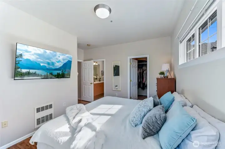 Featuring an attached en-suite bathroom and a substantial walk-in closet, the primary bedroom provides a private retreat with plenty of space.
