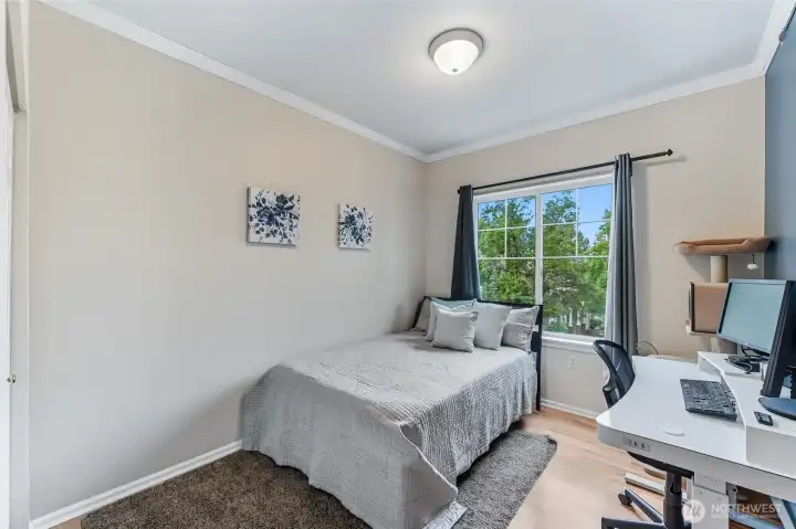 The second bedroom is generously sized, offering ample space to comfortably accommodate both guests and a home office.