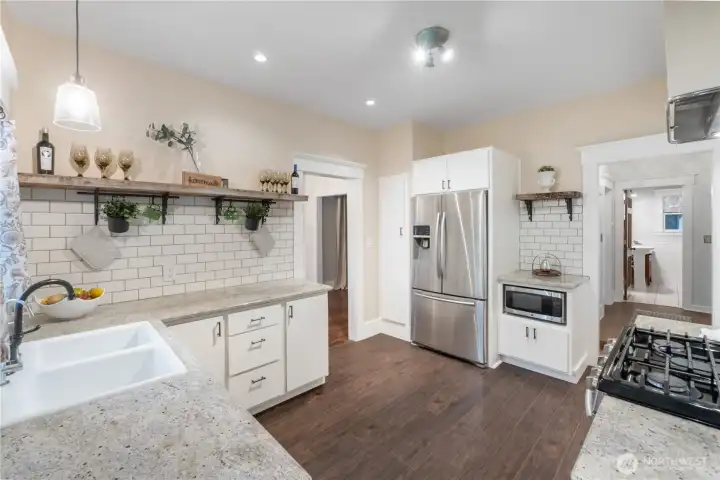 Floating shelves add to the character of this fresh kitchen