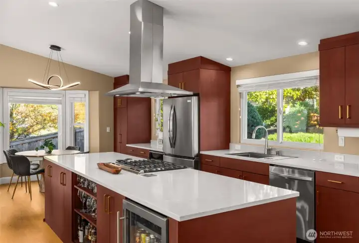 Fully remodeled designer kitchen. Quartz countertops, stainless steel appliances, beverage fridge, complete with a coffee bar.