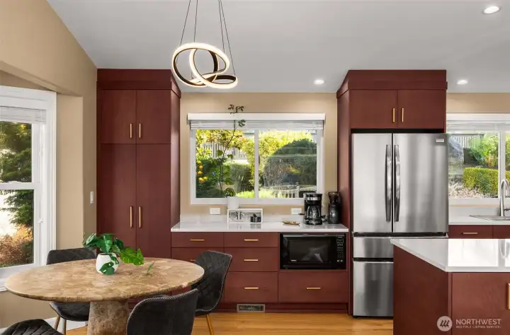 Custom cabinetry, dining nook and all new lighting.