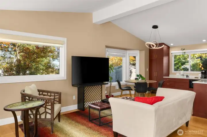 Spacious living room with new Anderson windows, new hardwoods and vaulted ceiling.