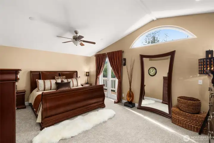 Primary suite with new carpet, walk-in closet, vaulted ceilings and a full ensuite.