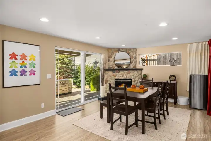 Lower level daylight basement living room with a gas fireplace.
