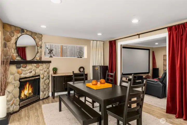 Lower level daylight basement living room with a gas fireplace.