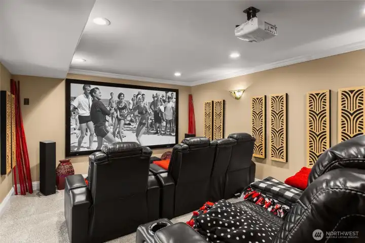 Movie theater room with new carpet,a platform and walk-in storage closet.