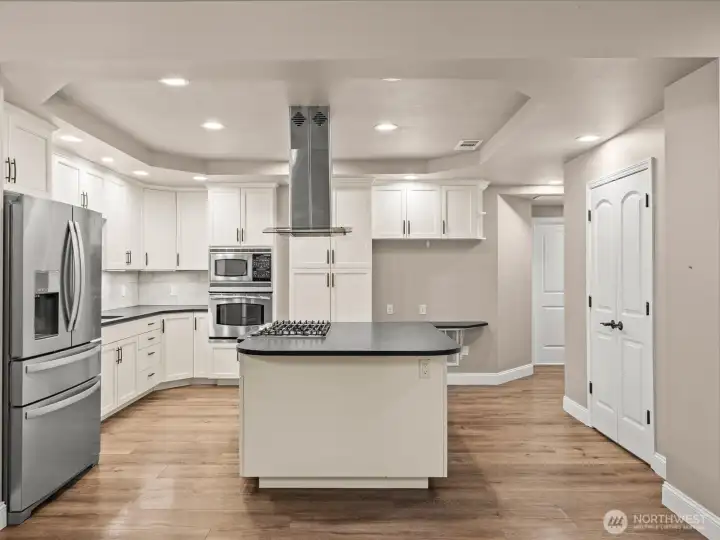 French doors to the right is a walk in pantry with tons of stoarge.