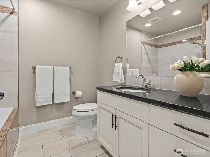 Full bathroom in the downstairs apartment.