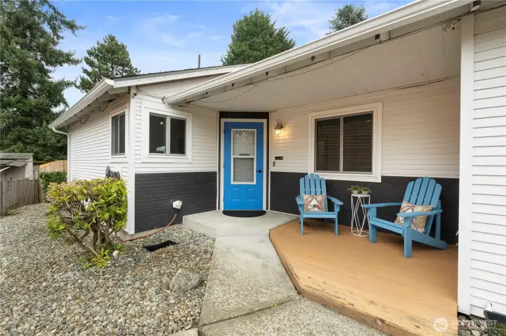 Front entrance w/nice decked seating area. Vinyl siding