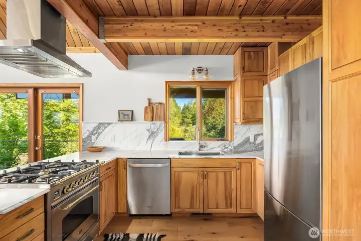 Imported marble cascade the counter and back splash in this new kitchen.