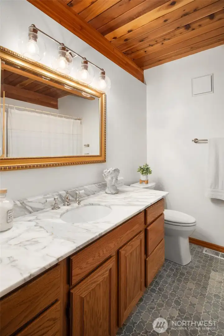 Main floor bath with tub and shower.