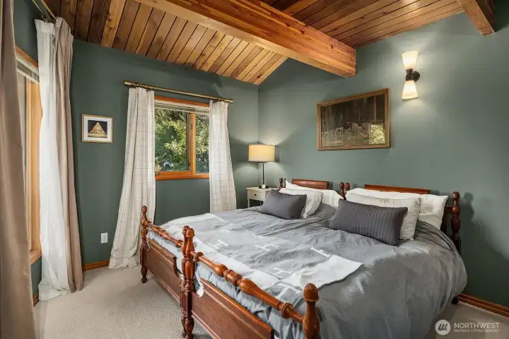 Garden suite offers a European king with orchard and mountain views.