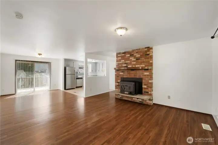 Woodstove insert and vinyl planked floors throughout