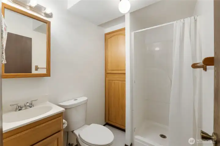 downstairs 3/4 bathroom with extra storage