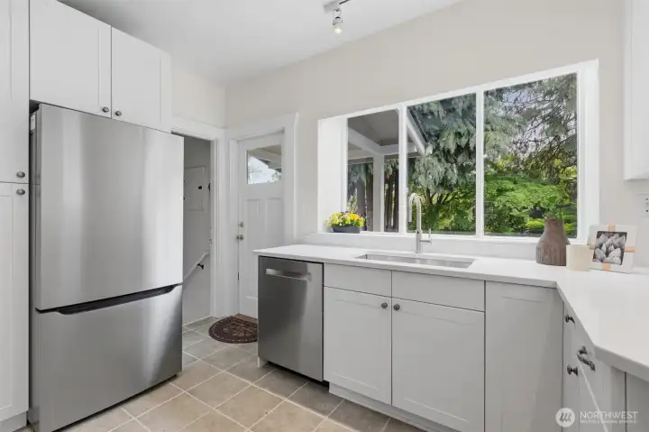Make your way past the newly installed fridge to access the lower level and backyard