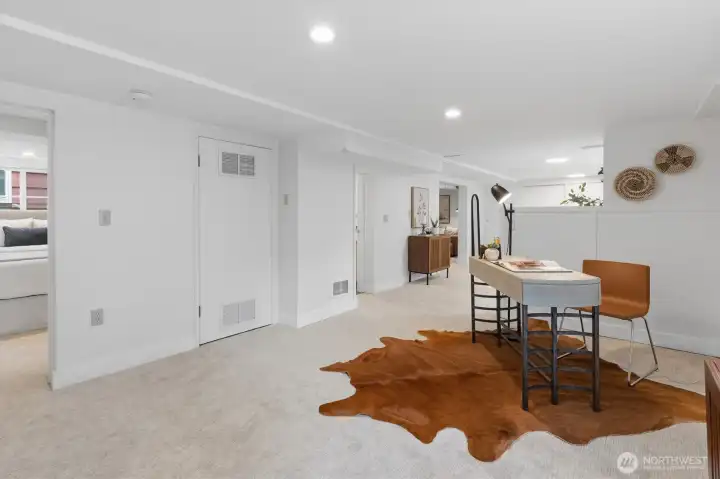 The lower level opens to a second living/flex space