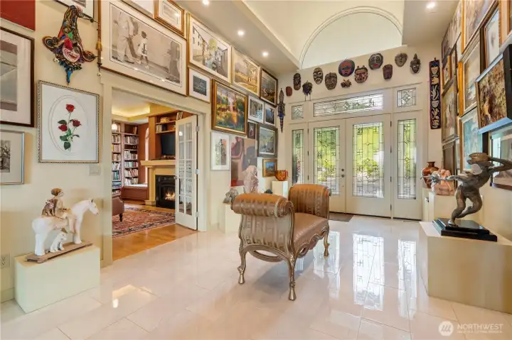 The arch of the porte cochere carries through the dramatic foyer creating for a breathtaking entry.