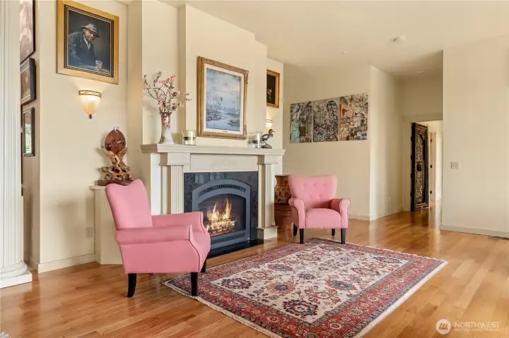 Living Room fireplace to set the cozy mood. Hardwood floor through the main part of the house.