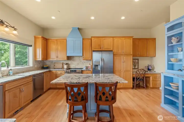 Ample counter and cabinet space. Stainless appliances include trash compacter. Oven range is plumbed for propane, but currently using electric.
